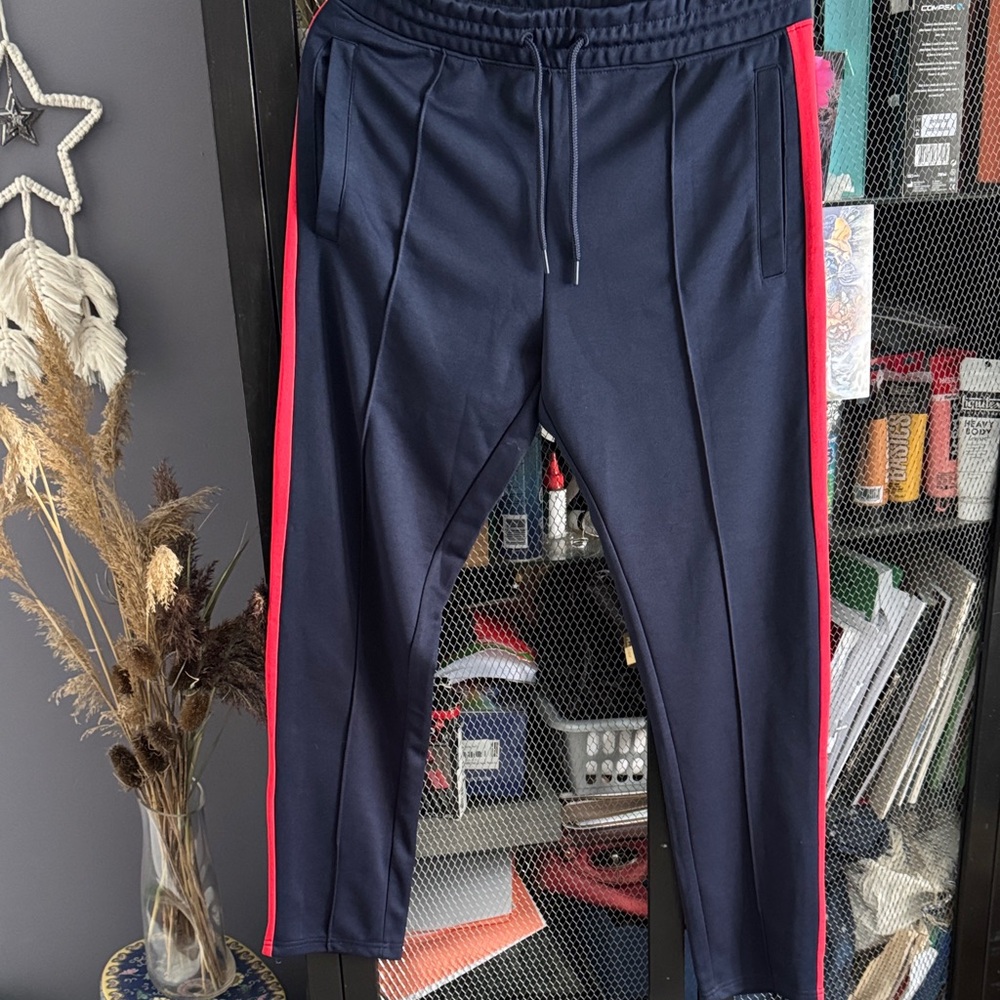 Divided Navy Joggers with Bold Red Stripes